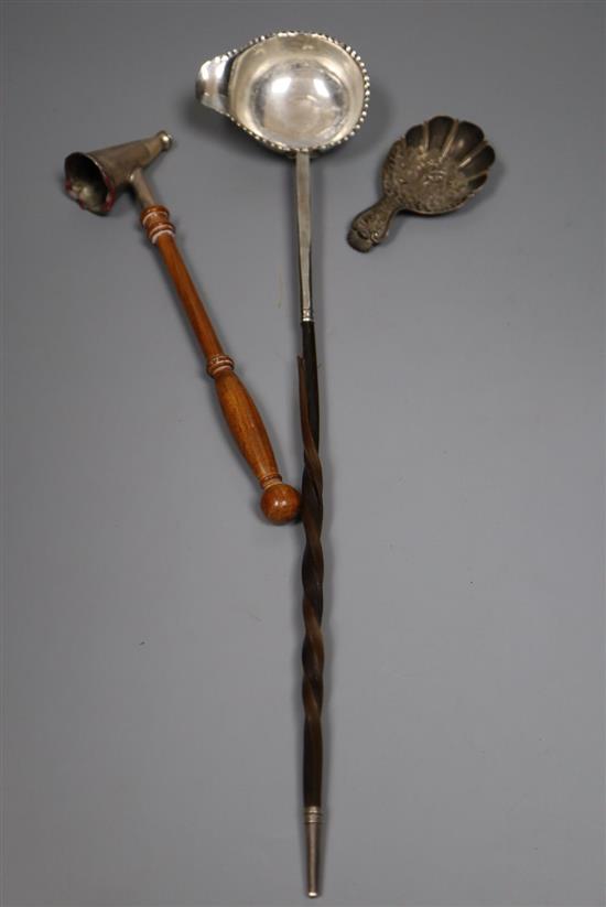 A George III silver caddy spoon, Joseph Wilmore, Birmingham, 1814, a silver candle snuffer and a white metal toddy ladle.